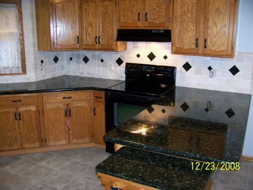 Natural Stone Backsplash with Granite Insets in Hudson, Ohio