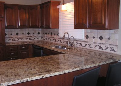 Travertine Backsplash with Copper Insets in Stow Ohio
