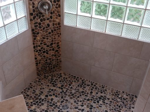 Porcelain Tile Shower with Pebble Stone Floors in Mayfield Heights, Ohio